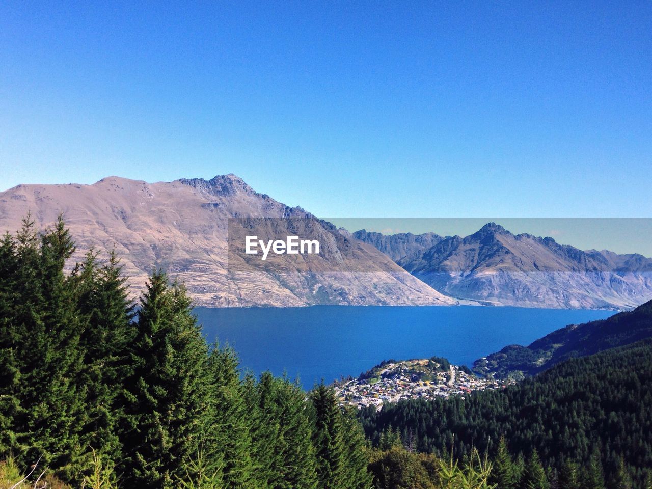 Scenic view of mountains against clear blue sky