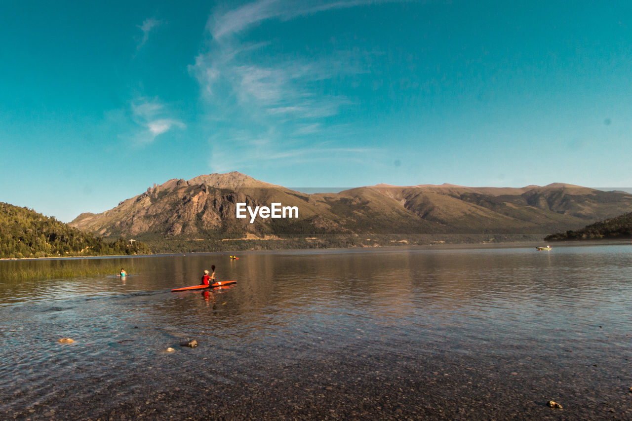 SCENIC VIEW OF LAKE AGAINST MOUNTAINS