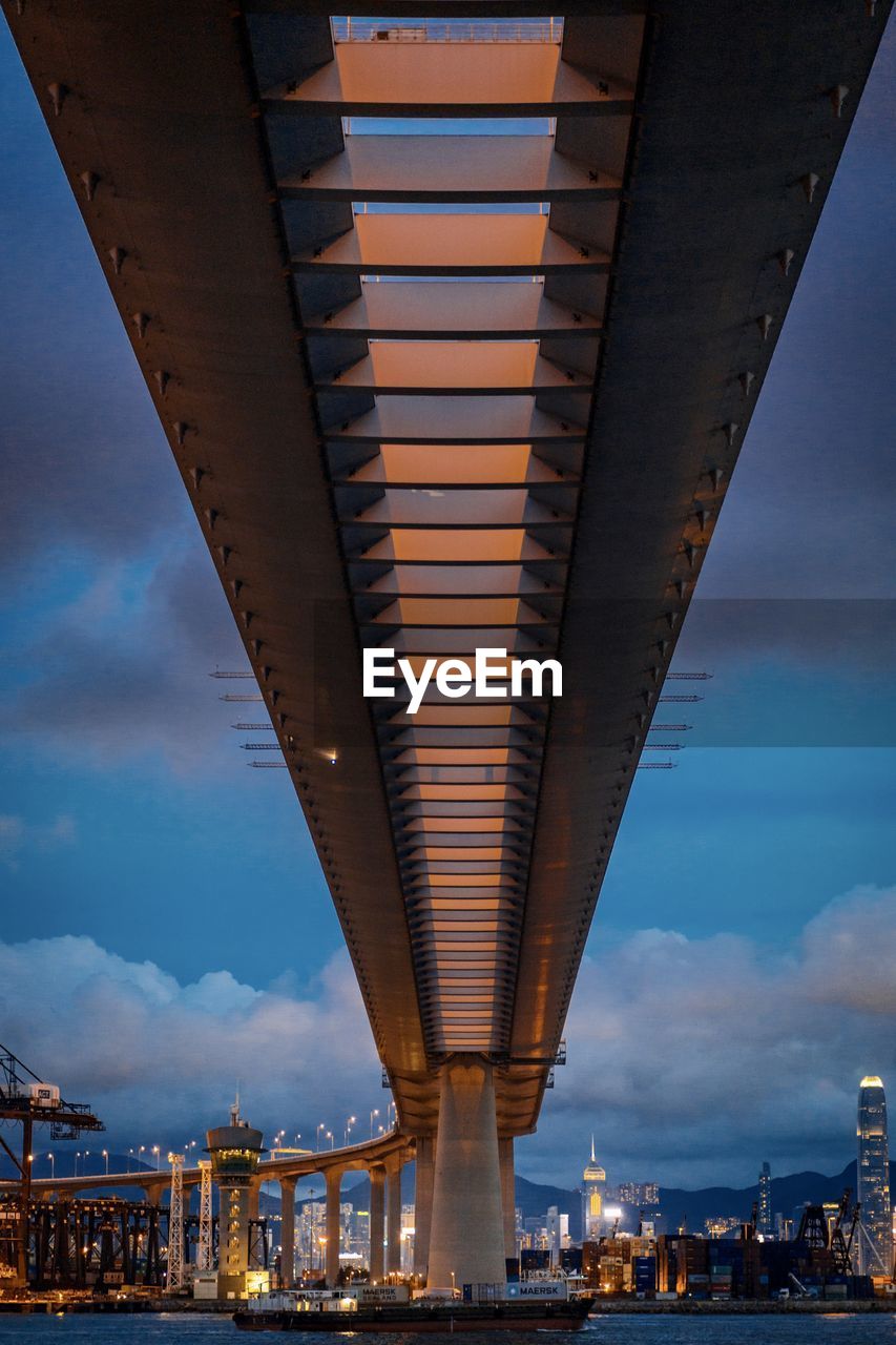 LOW ANGLE VIEW OF BRIDGE IN CITY