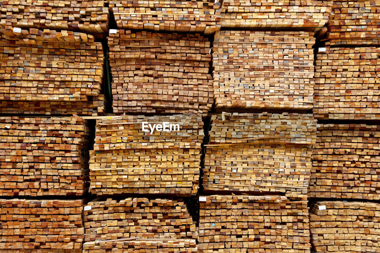 FULL FRAME SHOT OF BRICK STACK ON WOOD