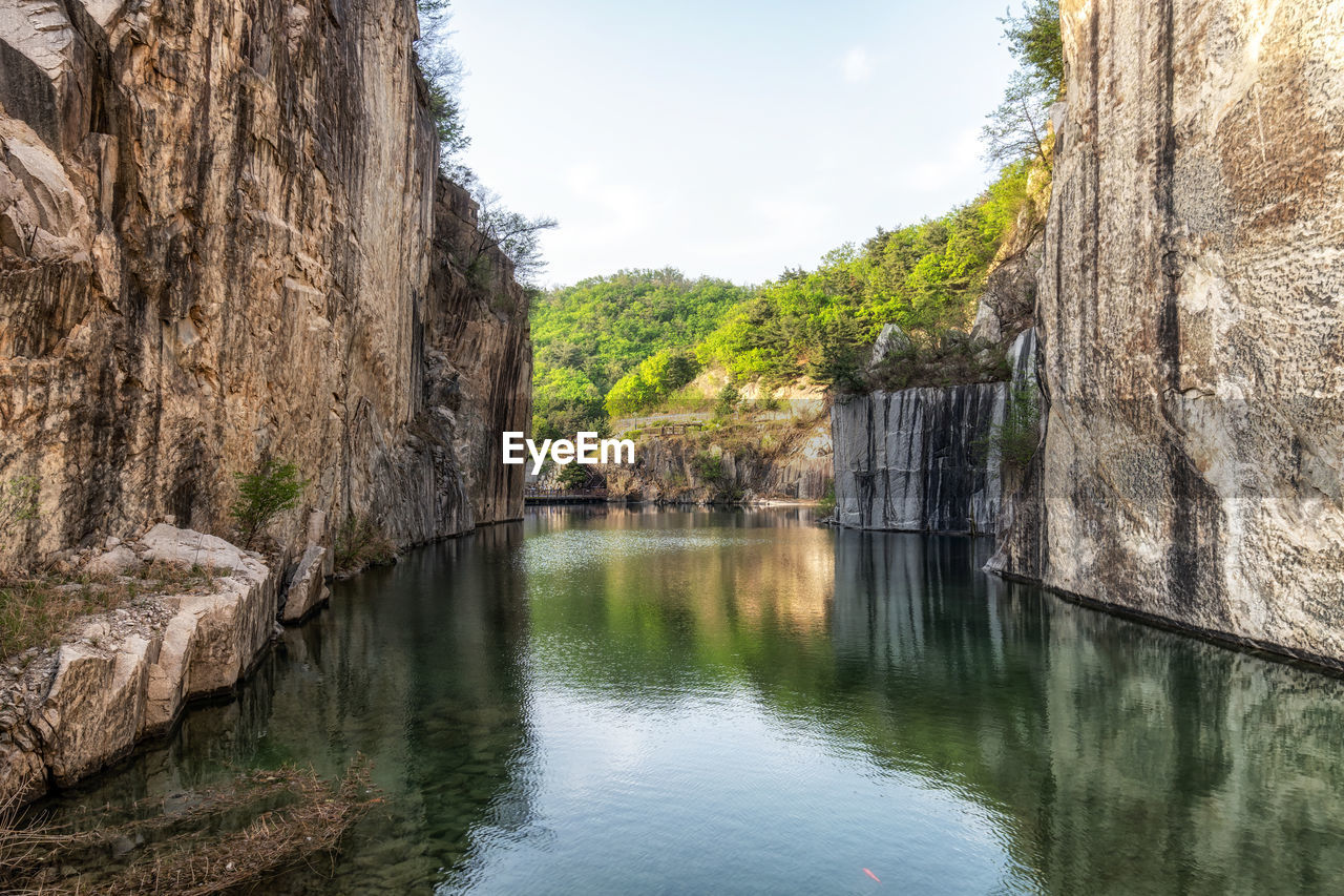 Small lake in pocheon art valley. an old granite quarry turned into park with famous granite cliffs.