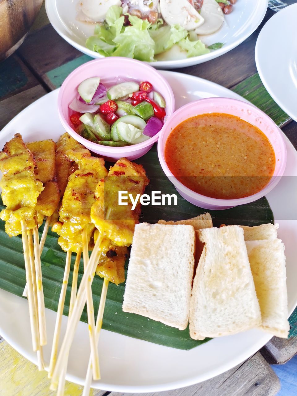 food and drink, food, healthy eating, plate, vegetable, wellbeing, freshness, dish, meal, high angle view, bowl, table, cuisine, no people, lunch, salad, asian food, sauce, fruit, breakfast, savory food, meat, condiment, indoors, satay, fast food, crockery, eating utensil