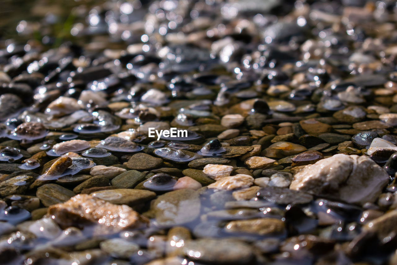 Full frame shot of stones in water