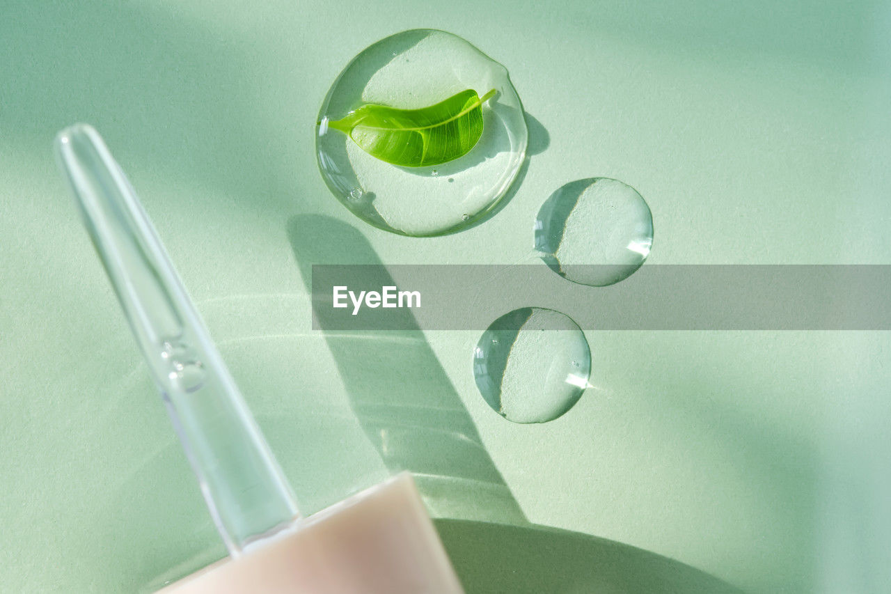 high angle view of dentures on glass on table
