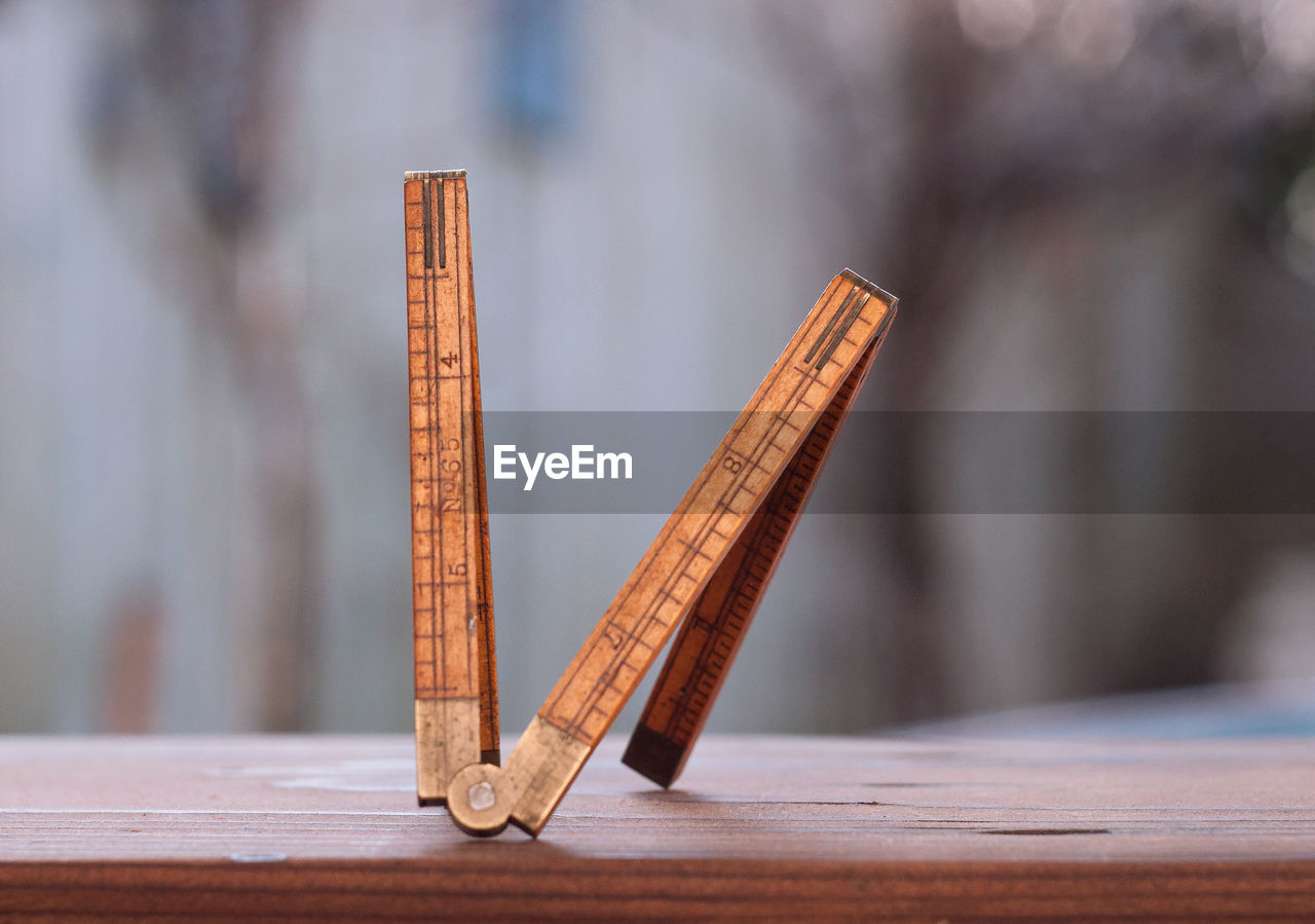 Close-up of wooden ruler on table