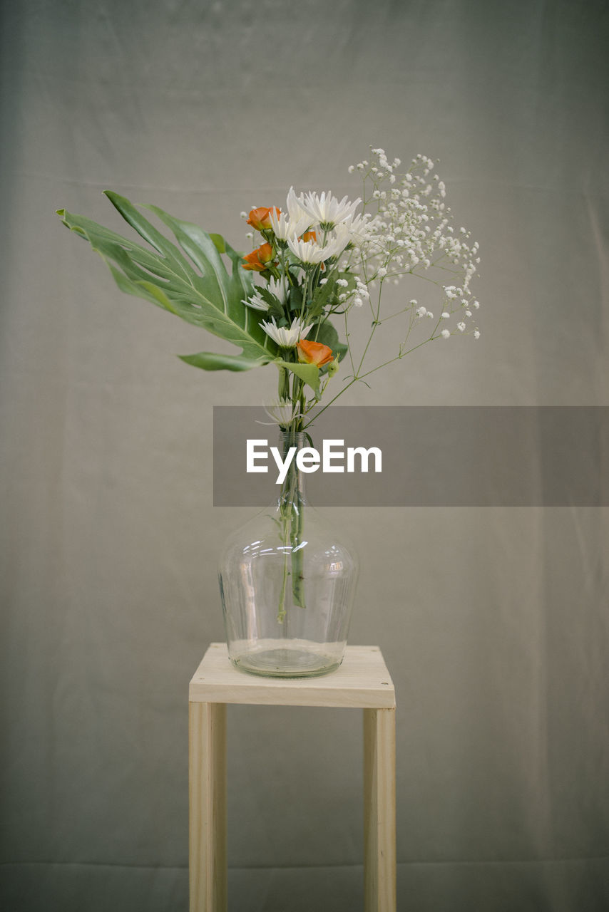 Close-up of white flower vase on table