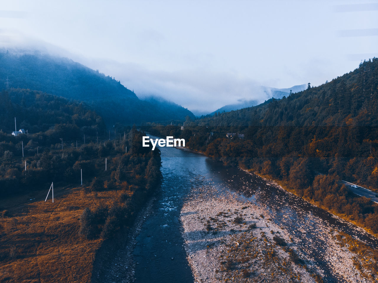 Autumn coming. aerial view of mountains with forest and yellow trees. nature landscape