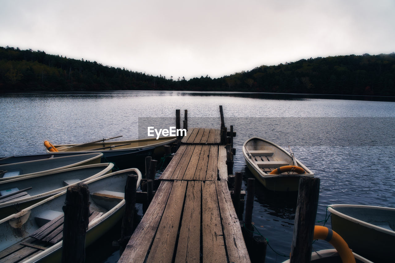 Pier over lake against sky