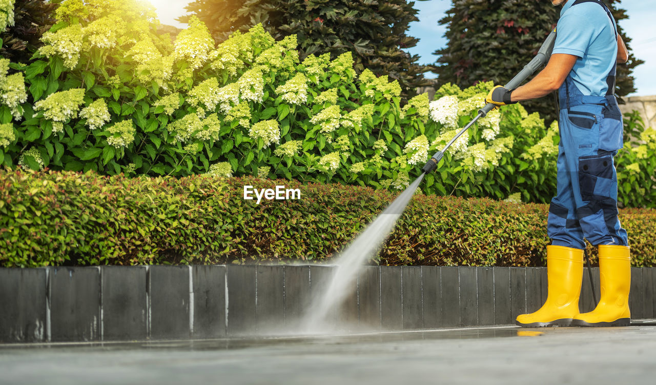 full length of man standing by fountain