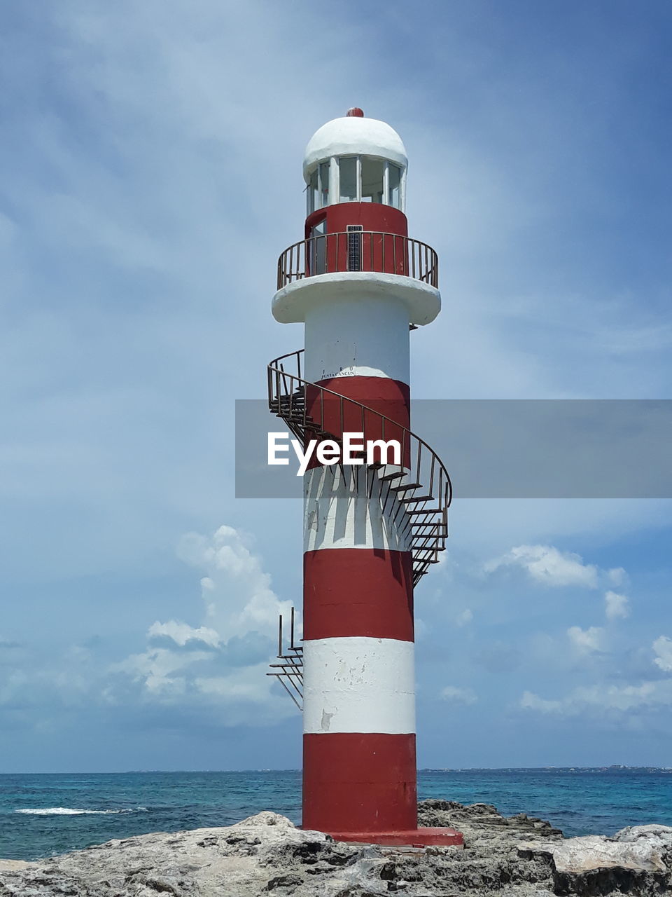 LIGHTHOUSE AGAINST SKY