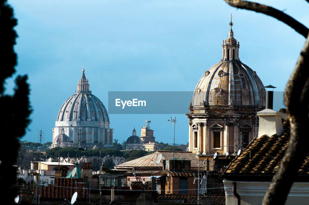 Panorama of rome, domes and roofs. on the left the dome of st. peter's basilica.