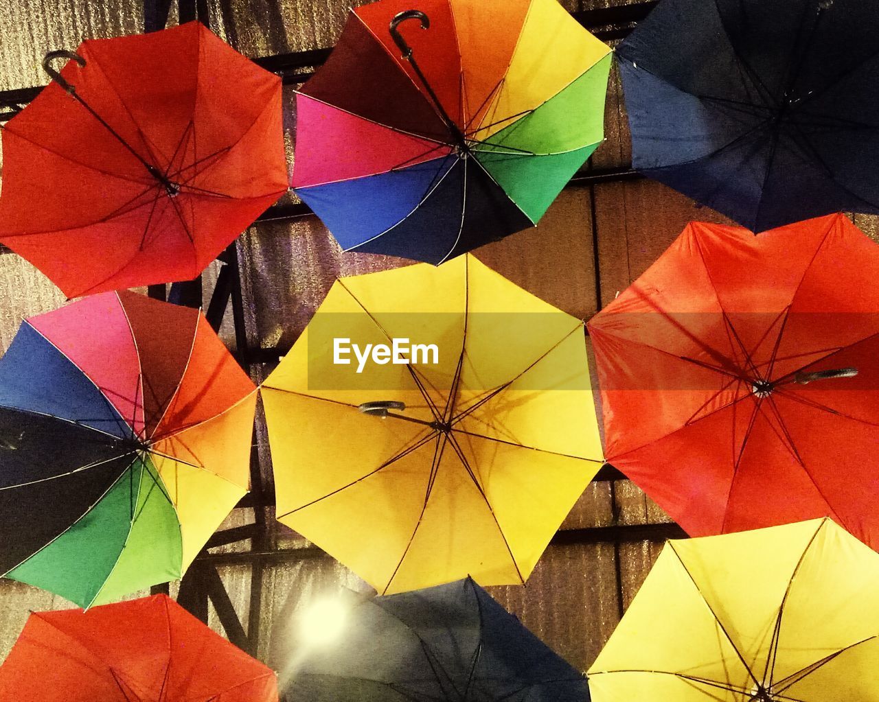 CLOSE-UP OF MULTI COLORED UMBRELLA