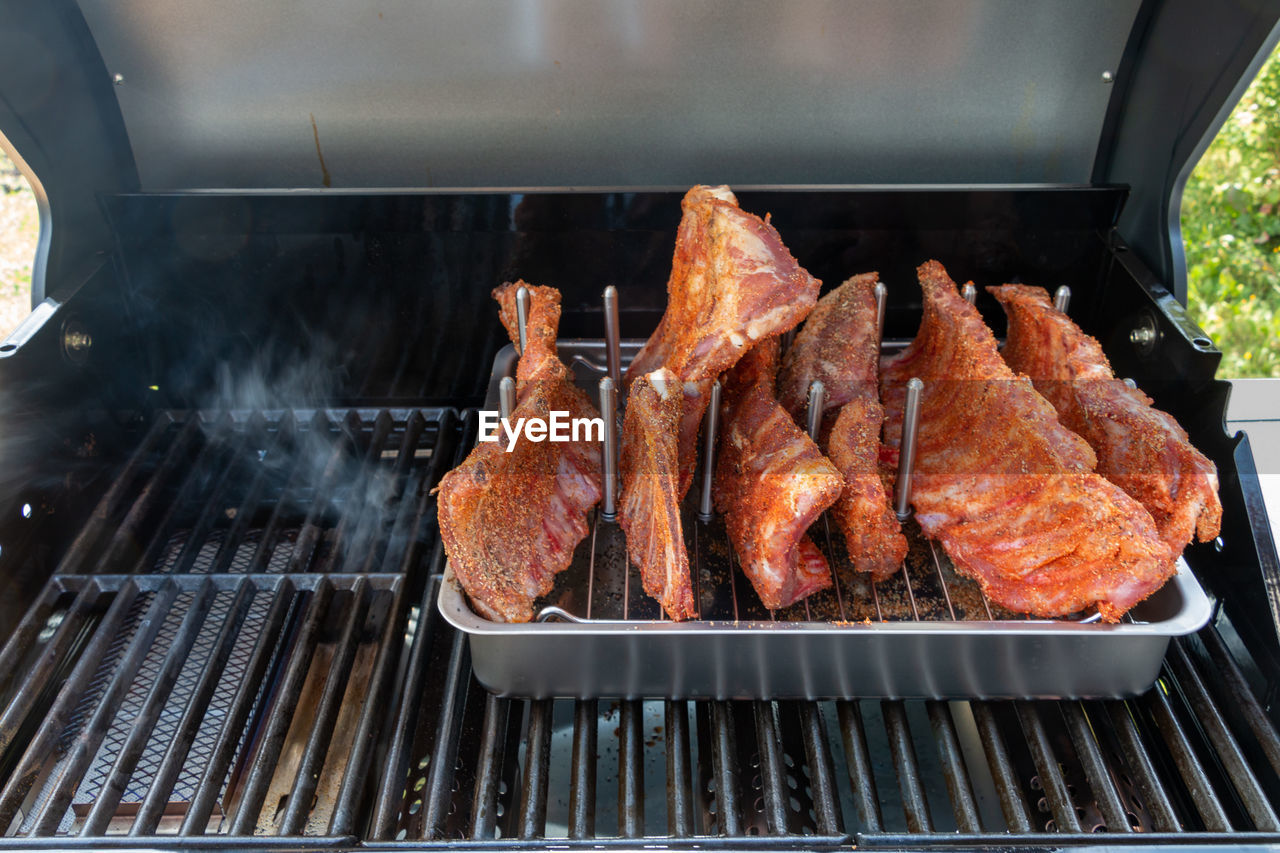 High angle view of meat on barbecue grill