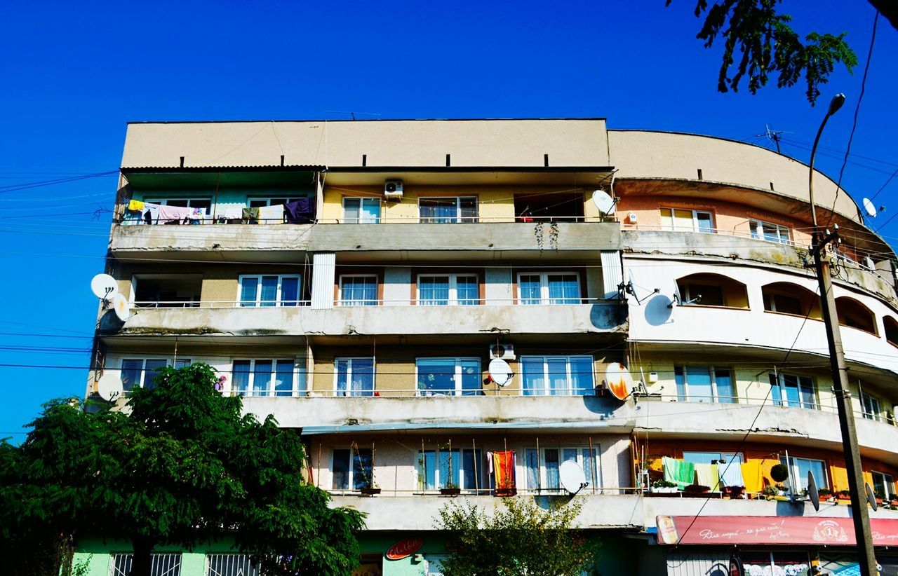 Low angle view of building against blue sky