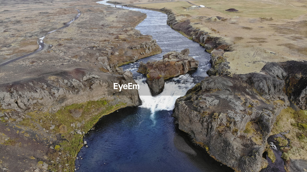 Aerial view of hjalparfoss waterfall in southwest iceland