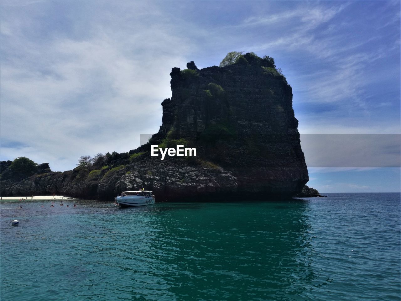 SCENIC VIEW OF ROCK FORMATION IN SEA