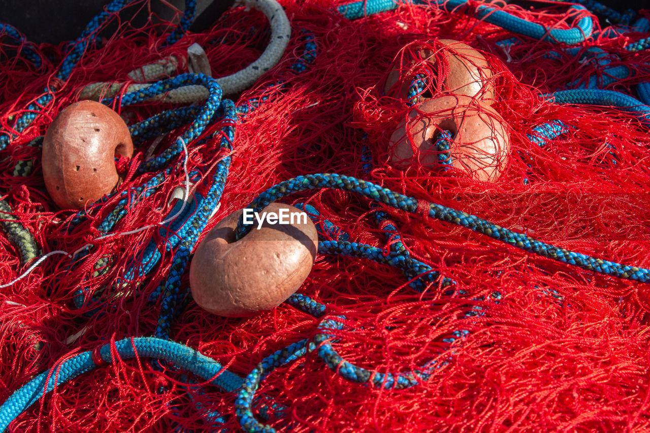 The object of red - blue fishing nets and floats .