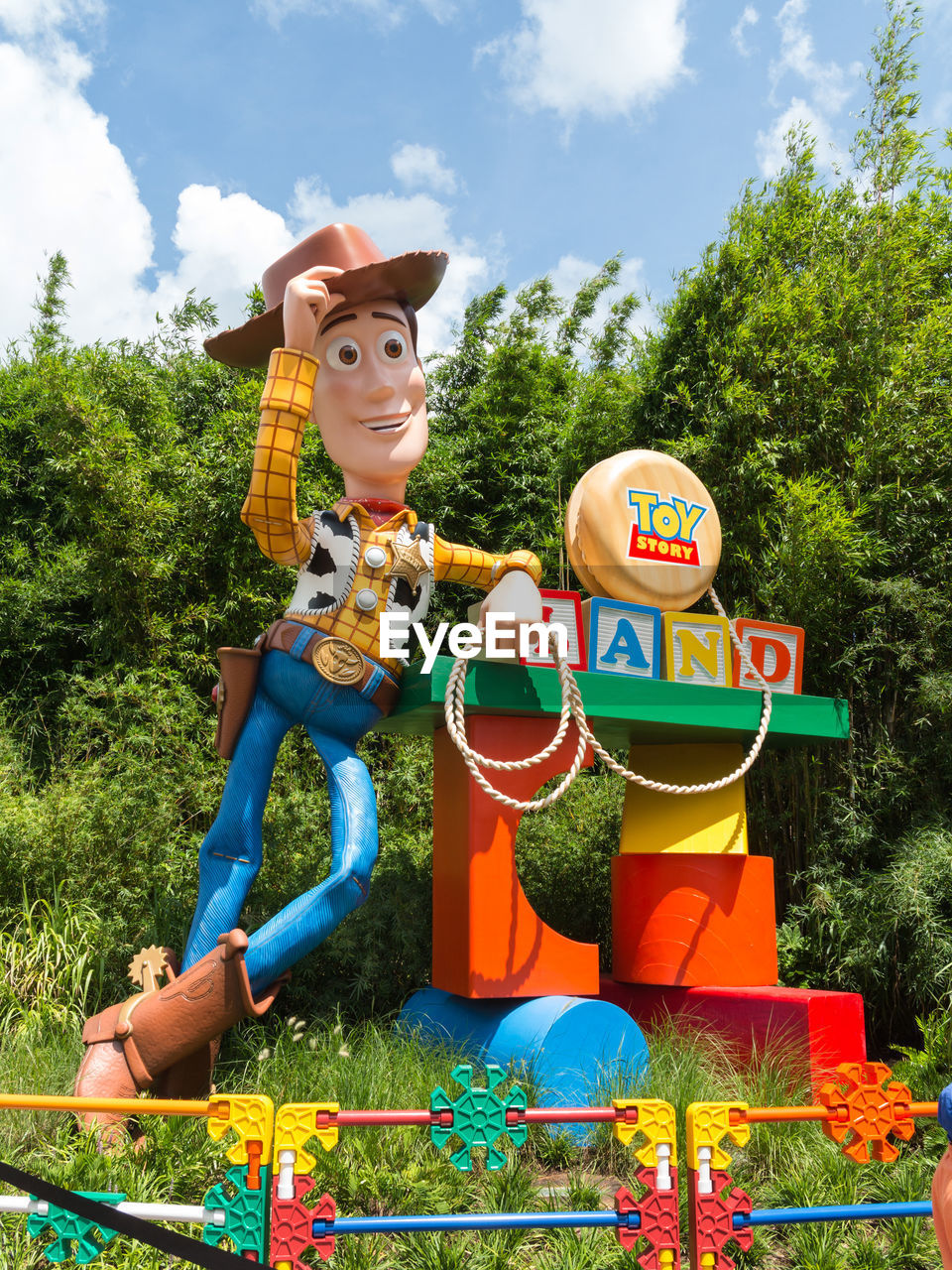 VIEW OF TOYS ON TREE AGAINST SKY