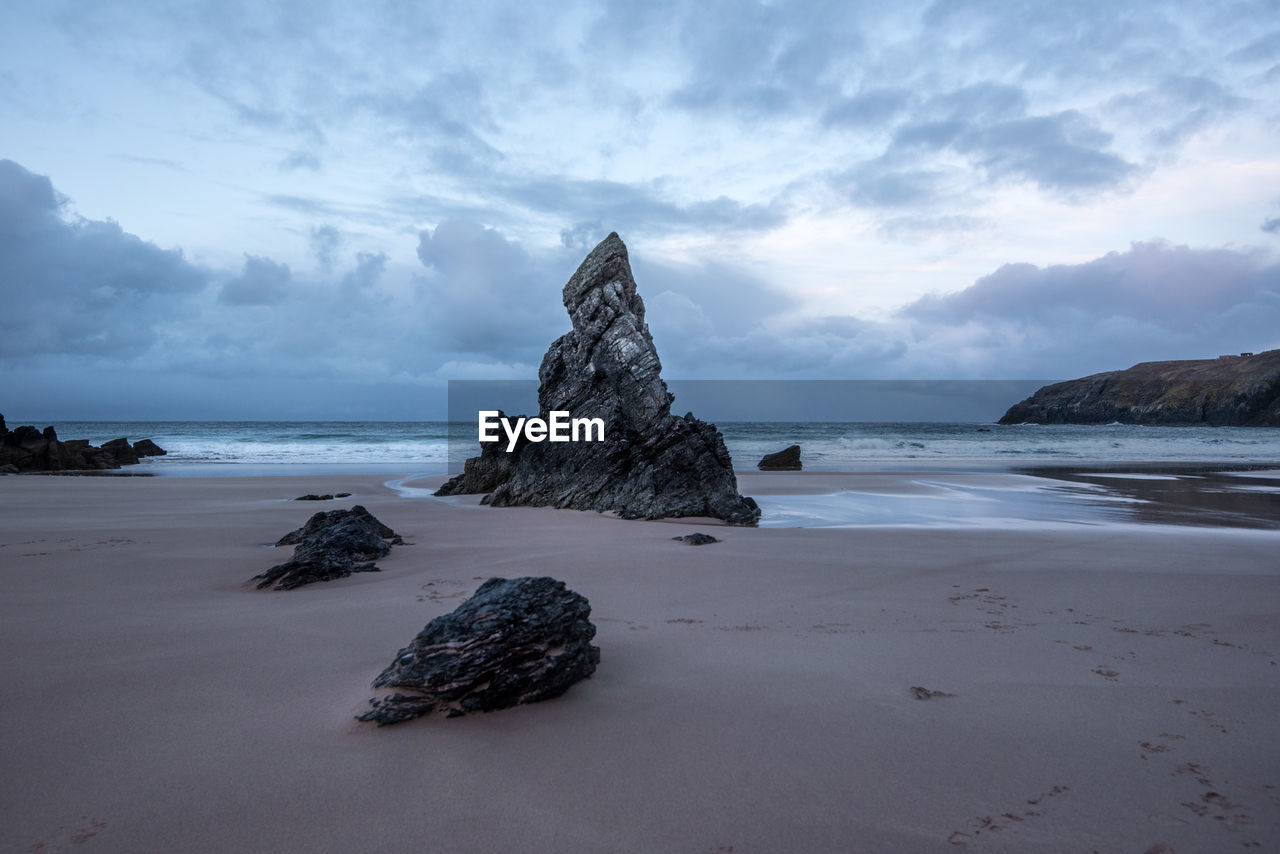 Scenic view of beach against sky