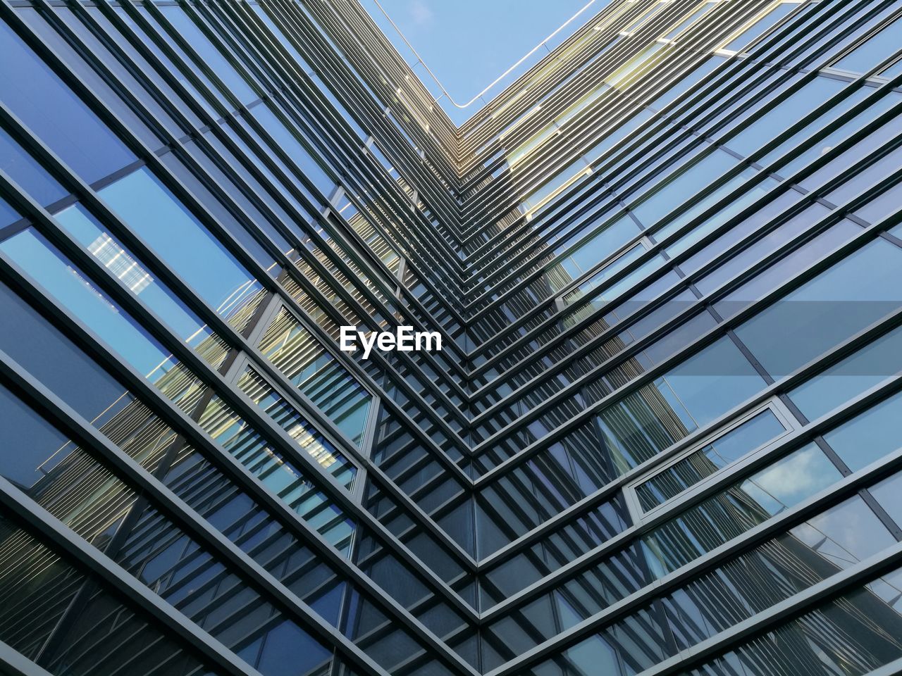 Low angle view of office building against sky