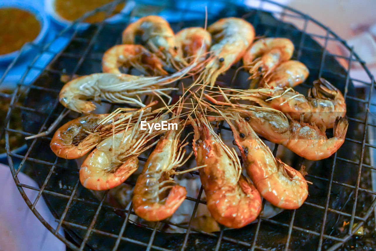 High angle view of meat on barbecue