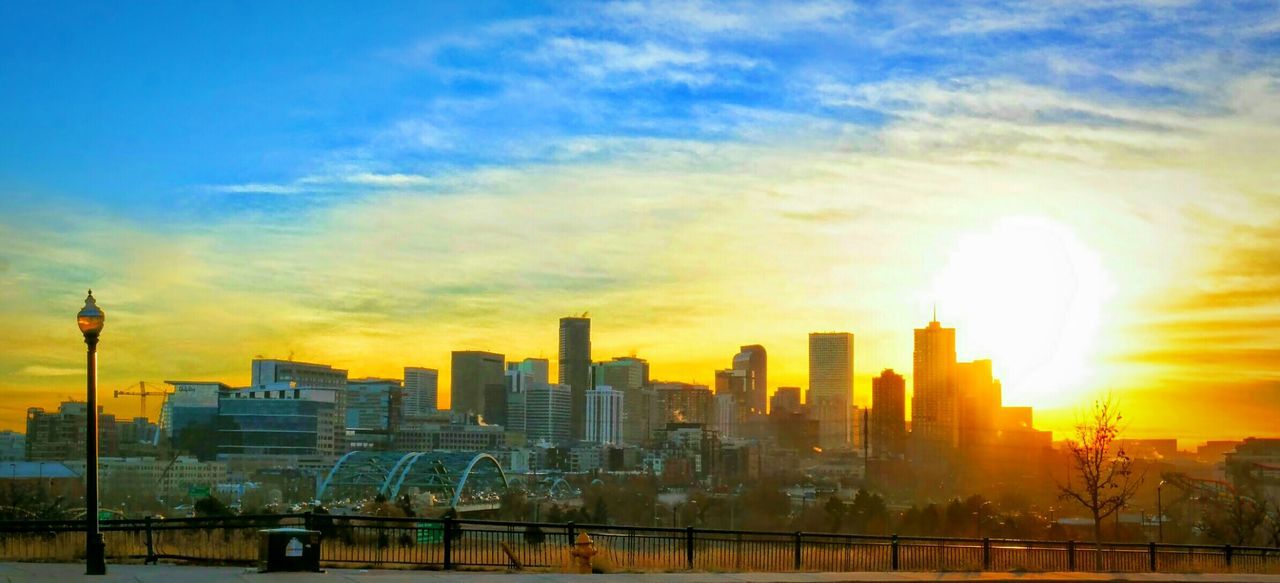 City skyline against orange sky