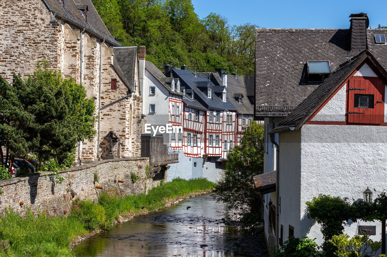 View at river elz, half-timbered houses in monreal, eifel, germany