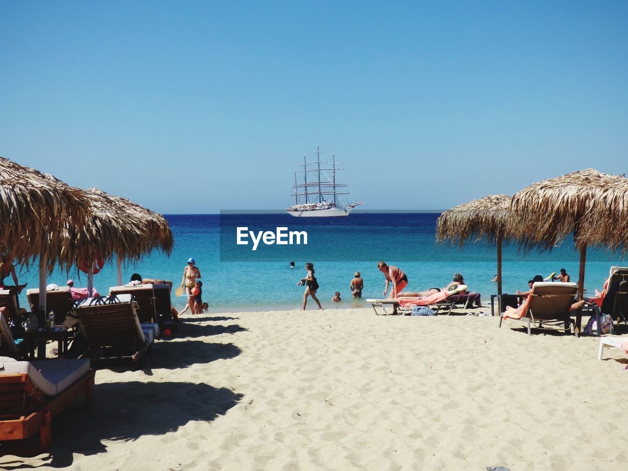 PANORAMIC VIEW OF PEOPLE ON BEACH