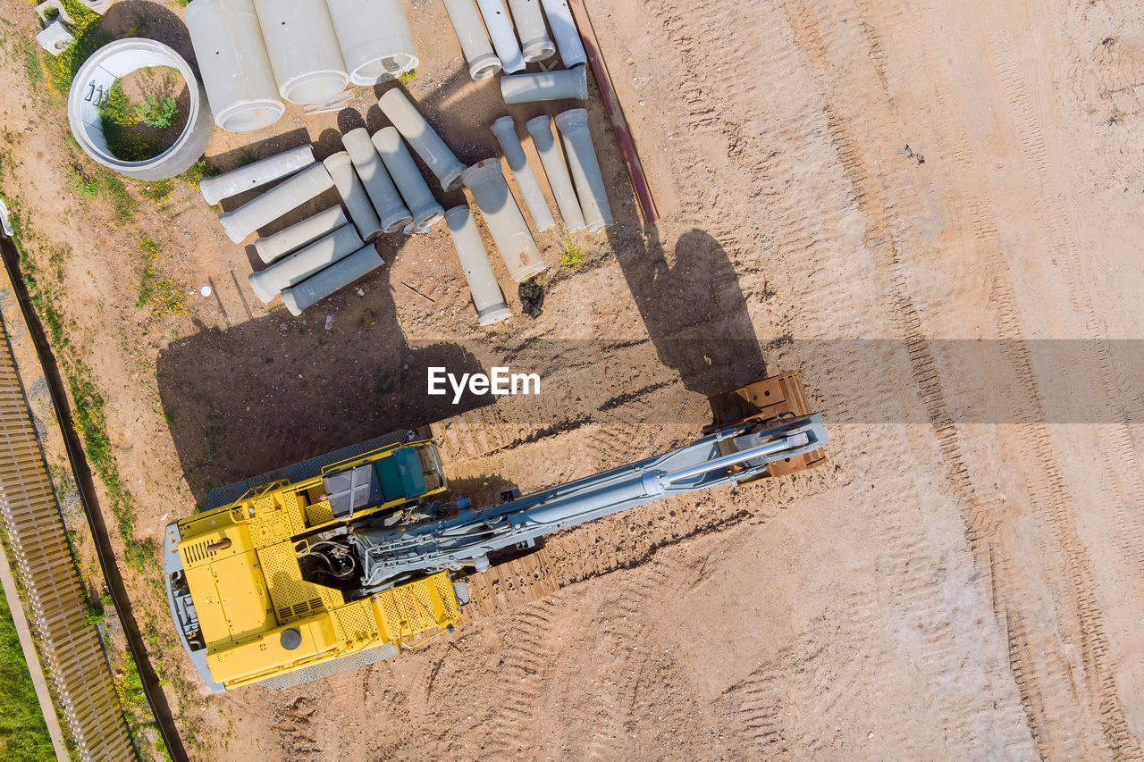 HIGH ANGLE VIEW OF CONSTRUCTION SITE ON SAND