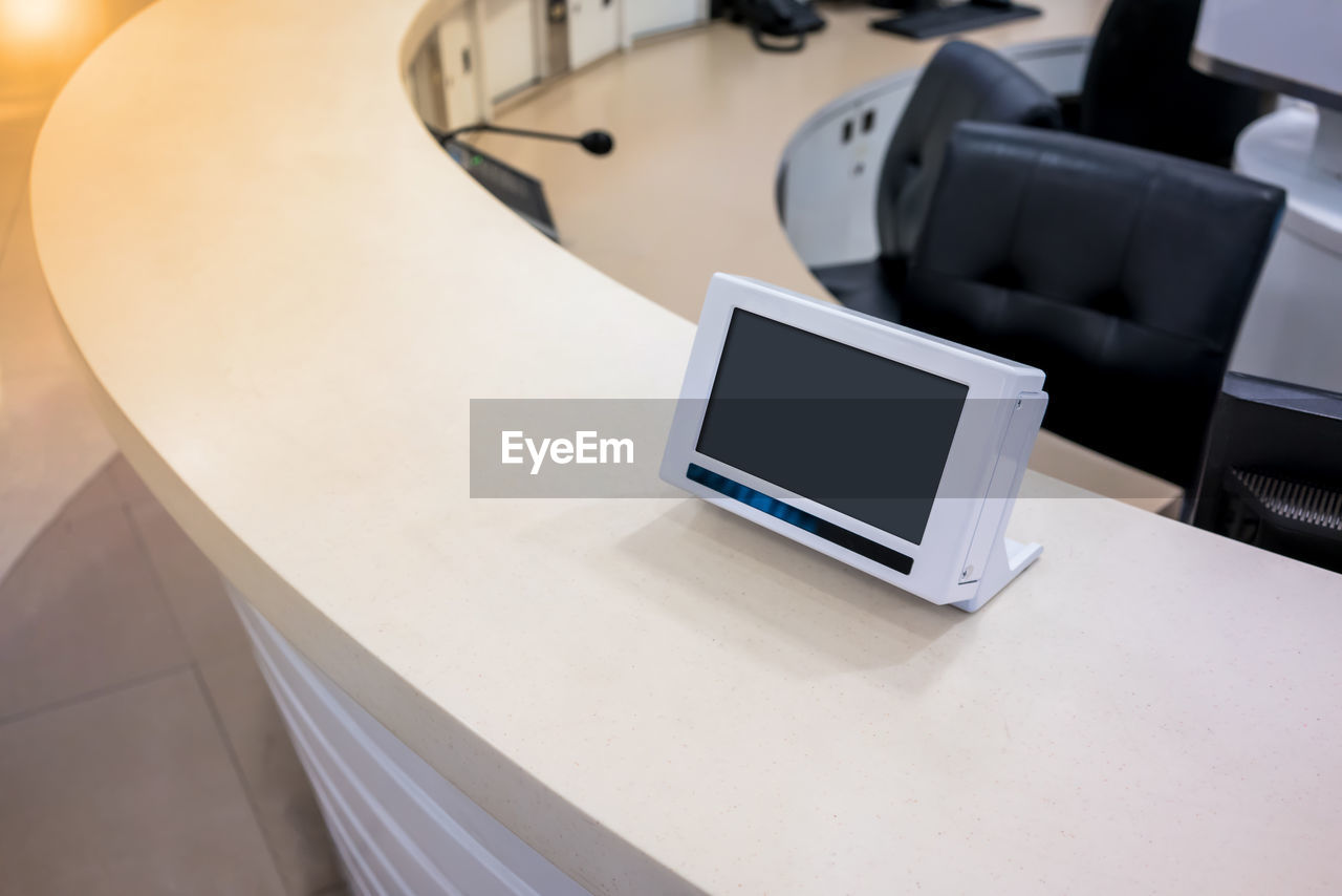 Digital tablet at reception counter in office