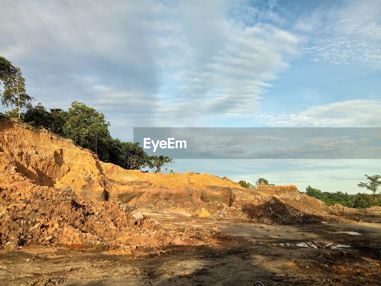 Rock formations on landscape against sky