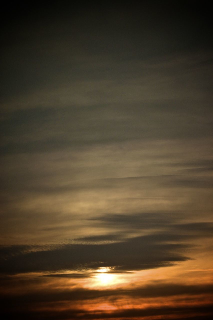 Scenic view of cloudy sky at sunset