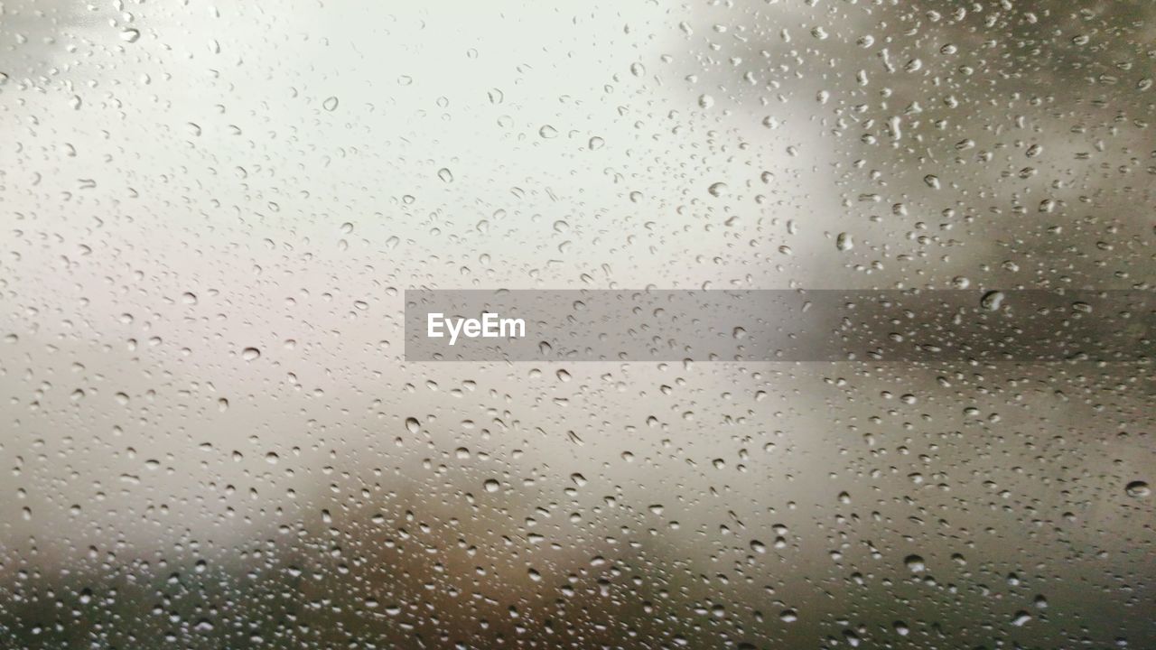 WATER DROPS ON GLASS WINDOW