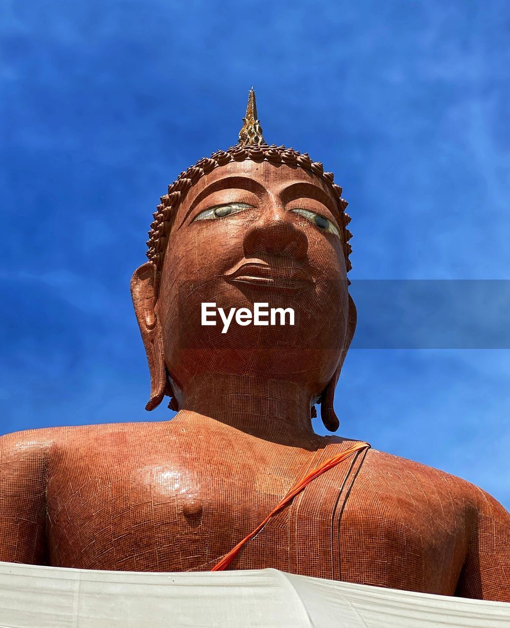 Low angle view of statue against blue sky