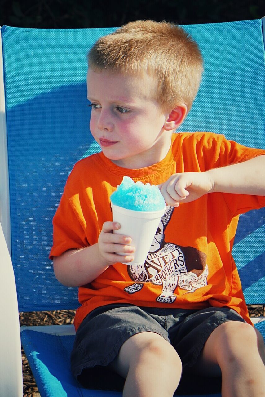 PORTRAIT OF CUTE BOY HOLDING WHITE BALL