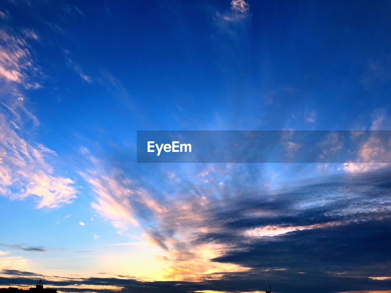 Low angle view of dramatic sky during sunset