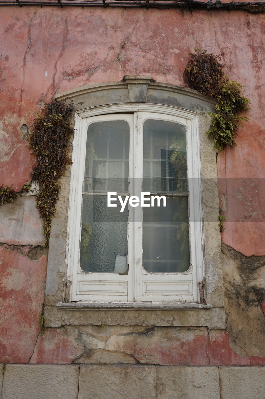 WINDOW ON OLD BUILDING