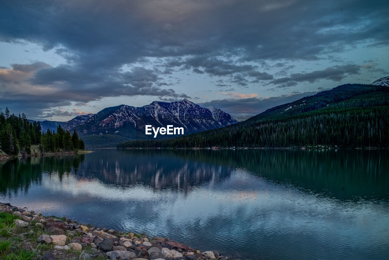 Scenic view of lake and mountains against sky