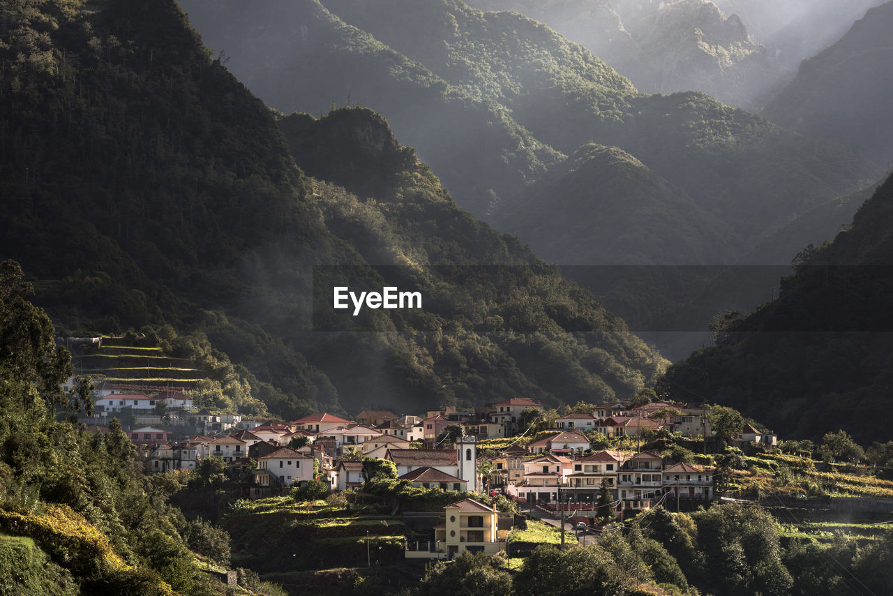 High angle view of townscape against mountains