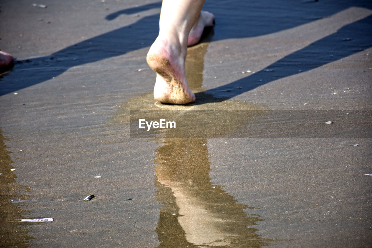 LOW SECTION OF MAN IN WATER