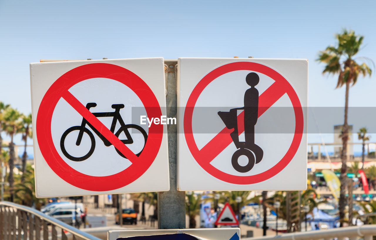 ROAD SIGN AGAINST CLEAR SKY