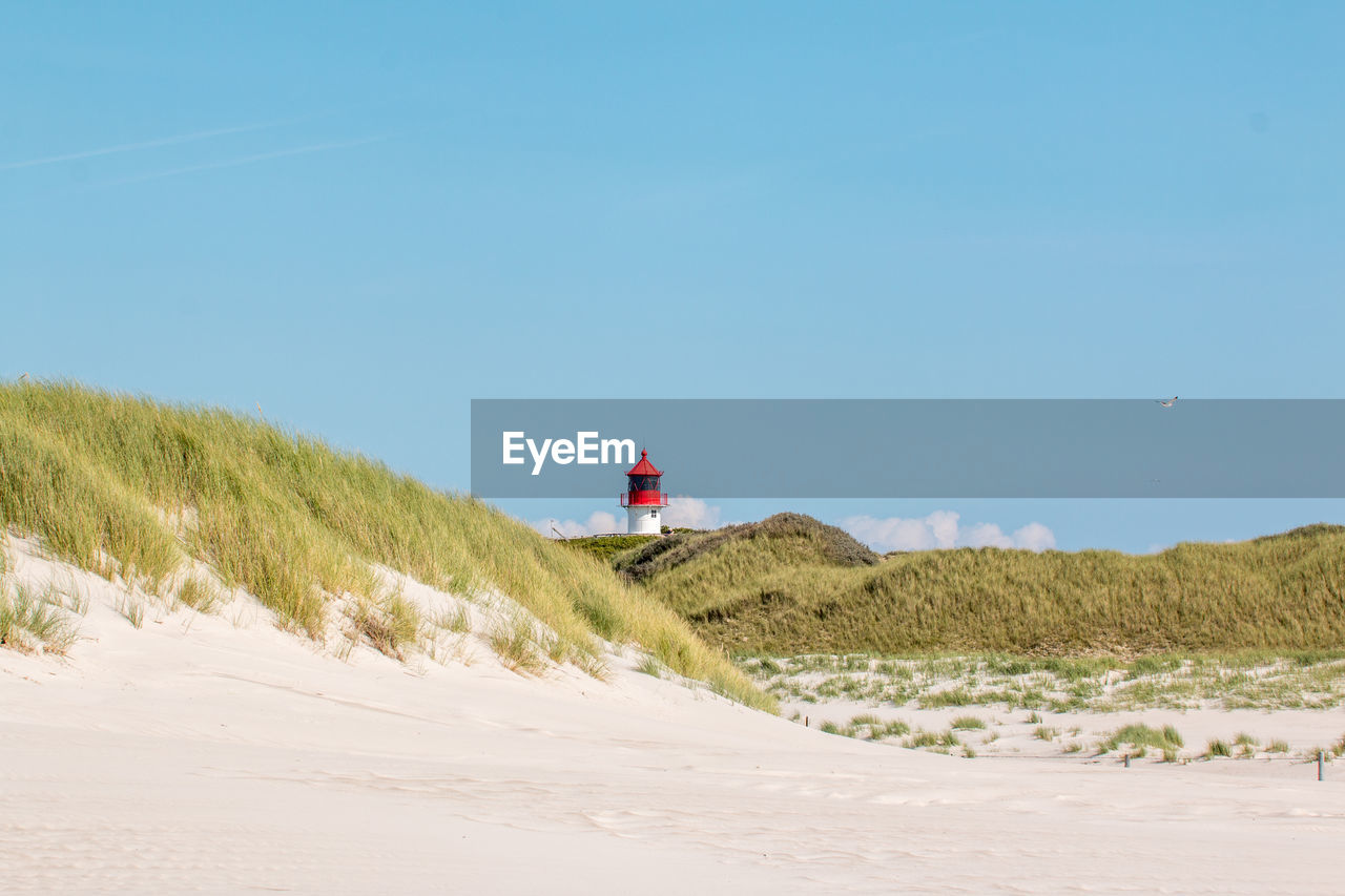 Scenic view of beach against clear sky