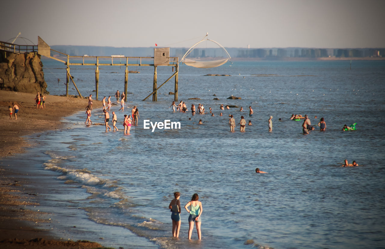 GROUP OF PEOPLE AT BEACH