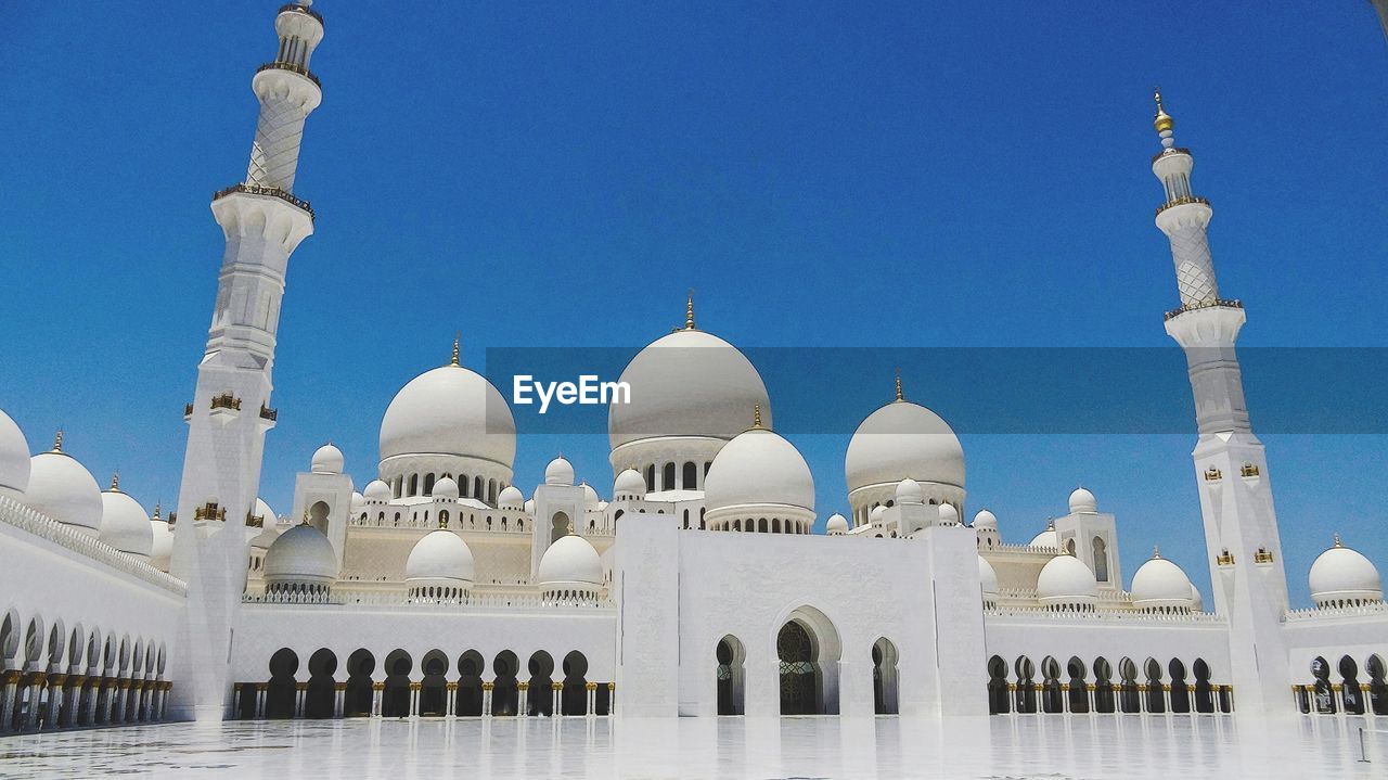 Low angle view of grand mosque against sky