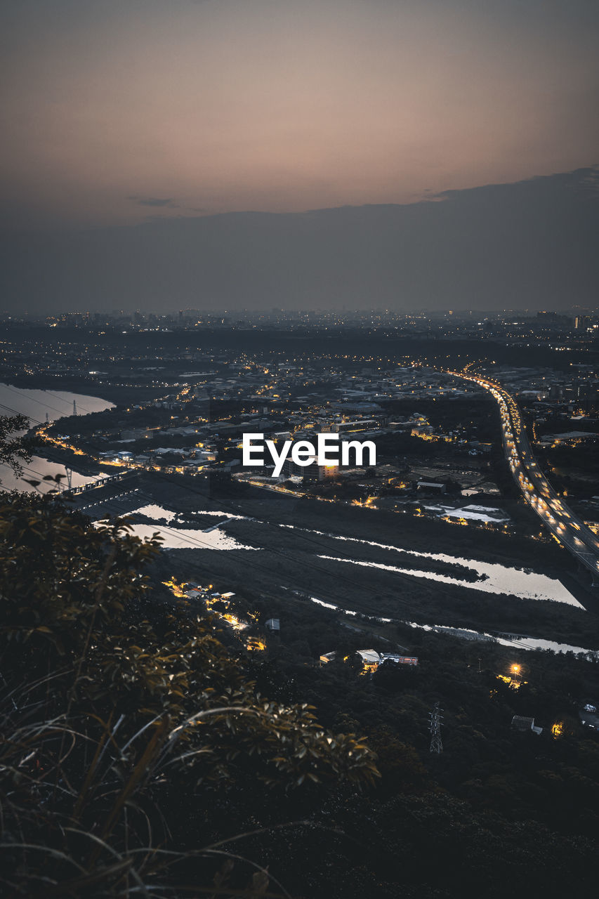 High angle view of city at sunset