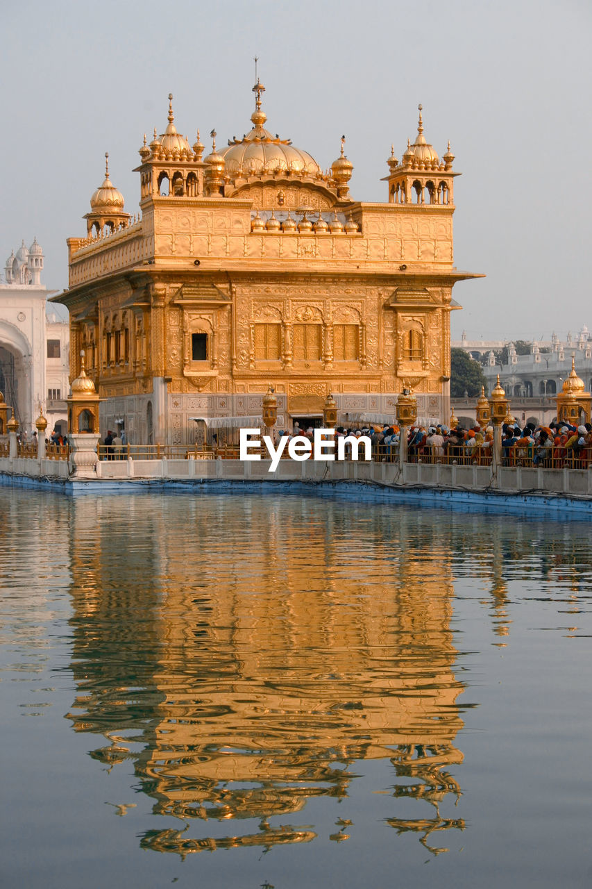 Reflection of building in lake - golden temple amritsar 