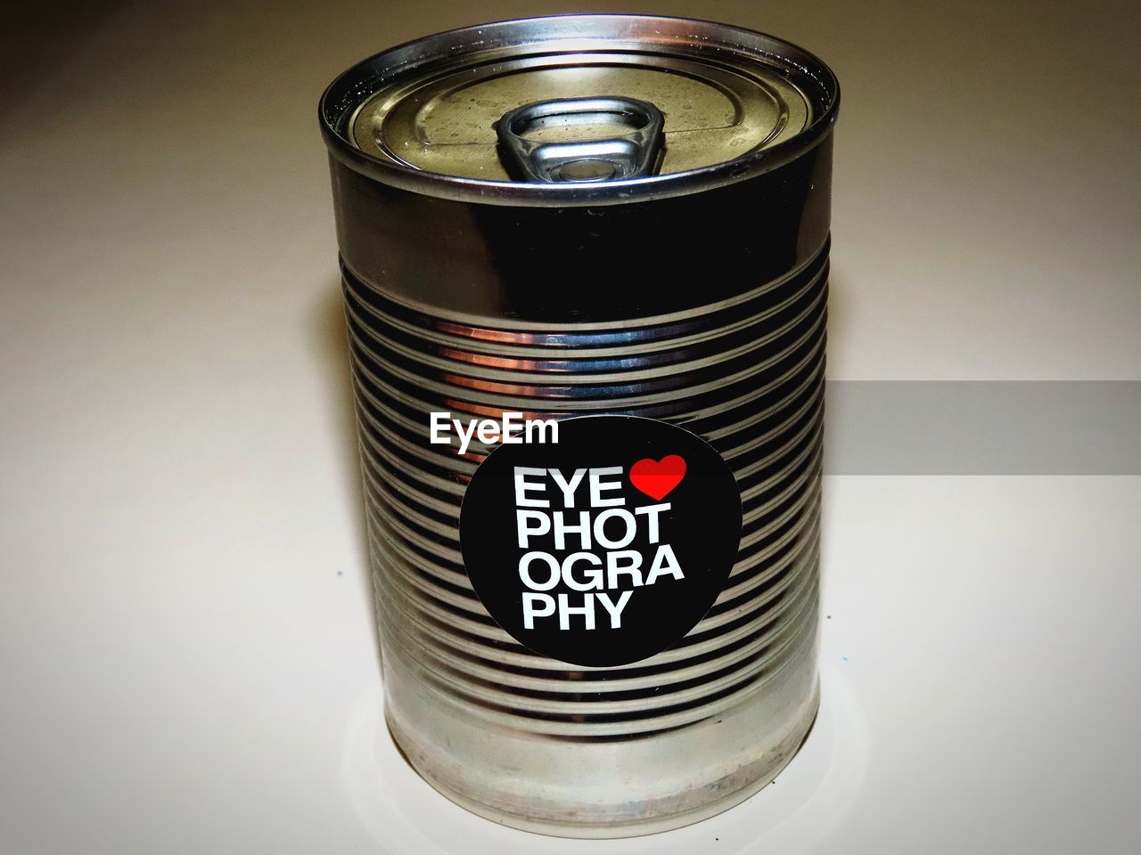 tin can, aluminum can, can, metal, drink can, soft drink, single object, studio shot, no people, indoors, text, aluminum, container, drinkware, drink, communication, close-up, food and drink