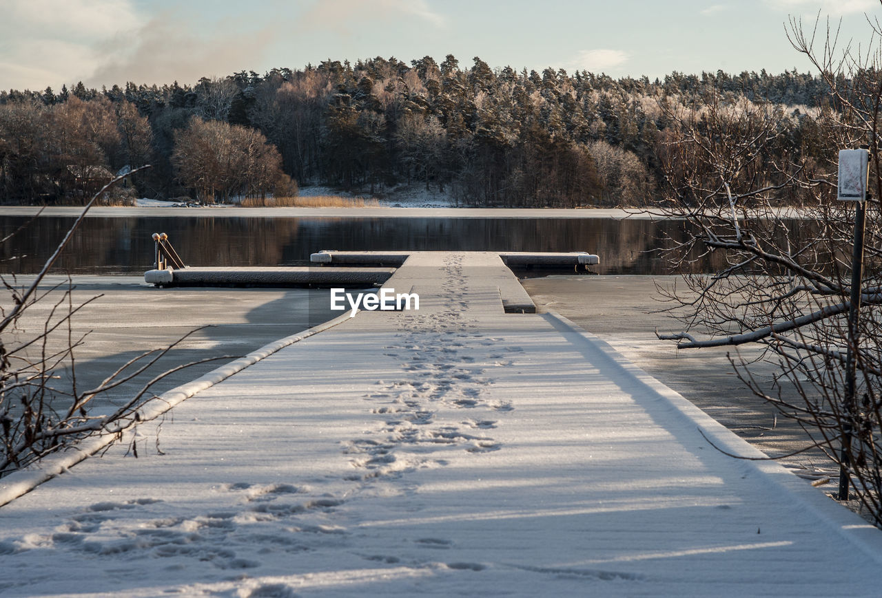 Scenic view of frozen lake against sky