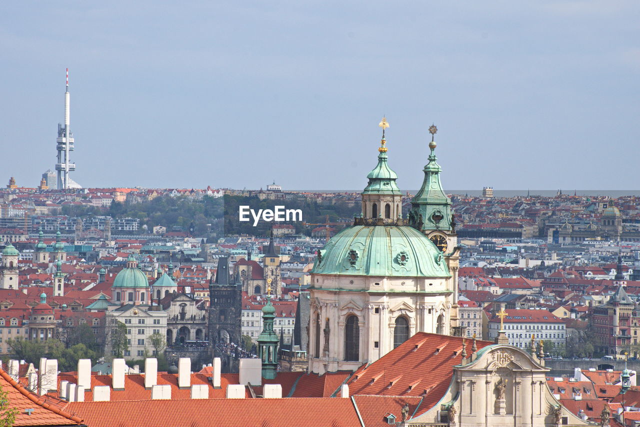 View of buildings in city against sky