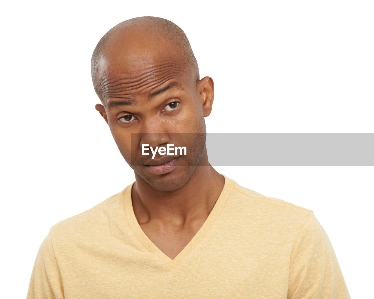 portrait, shaved head, one person, studio shot, white background, headshot, adult, looking at camera, casual clothing, cut out, men, indoors, young adult, copy space, front view, human hair, serious, emotion, person, looking, relaxation, human face, human head, t-shirt, tan, finger, completely bald, facial expression, contemplation